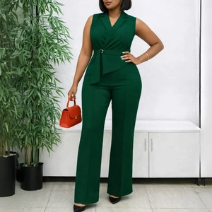 Detail of dark green sleeveless jumpsuit with lapel collar and waist tie belt