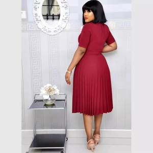 Elegant deep red short sleeve pleated midi dress shown from a back perspective