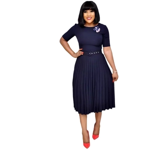 Short sleeve dark blue pleated dress with waist belt and flower detail on the round neck