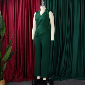 Detail of dark green sleeveless jumpsuit with lapel collar and waist belt on mannequin