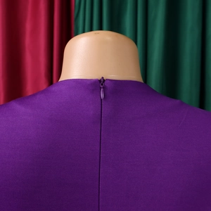 Macro detail of high-quality invisible back zipper on a purple pleated dress with texture