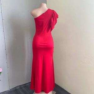Detail of elegant red one-shoulder evening gown with ruffled sleeve and bodycon mermaid cut
