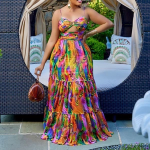 Women's summer maxi dress with colorful feather print, cutout waist, and tiered skirt