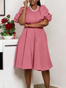 Elegant pink puff sleeve dress with a round neck and pleated A-line skirt silhouette