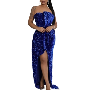 Detail of royal blue sequin evening dress with ruffle trim and high slit design
