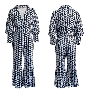 Front and back view of houndstooth print jumpsuit with V-neck and wide leg design