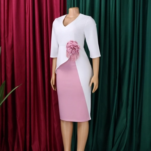 Detail of elegant waist decoration featuring a 3D pink flower and stylish pink tassels