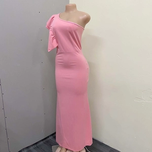 Detail of the elegant pink off-shoulder evening dress with layered ruffle cascade