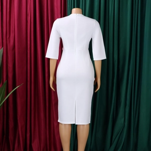 Detail view of the back invisible zipper and slit design of this white pencil dress