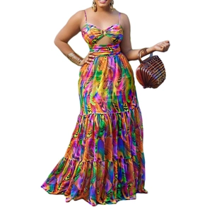 Bohemian maxi dress with colorful feather print, featuring cut-out waist and metallic ring