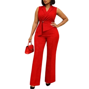 Detail of red sleeveless blazer jumpsuit with a metal buckle belt and high waist wide legs