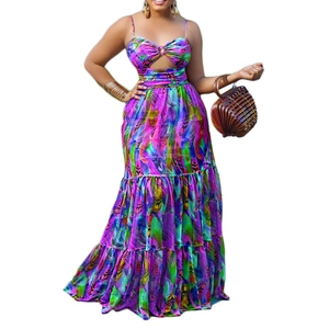 Detail of bohemian floral print maxi dress featuring cutout chest and tiered skirt