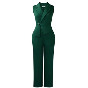 Detail of dark green sleeveless jumpsuit showing lapel collar and belted waist design
