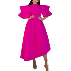 Detail view of double-layered ruffle sleeves on a rose red cocktail party dress