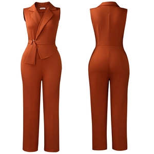 Detail view of sleeveless rust red jumpsuit featuring a lapel collar and waist belt