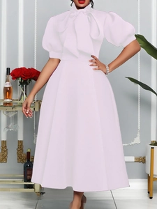 Elegant light pink midi dress with large bow tie neckline and puff short sleeves