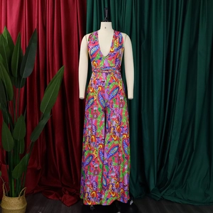 Detail view of the colorful Paisley print and deep V-neck on this bohemian romper