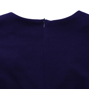 Detail view of the dark blue dress featuring a hidden back zipper and smooth neckline