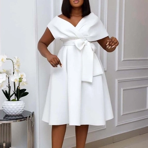 Detail of elegant white off-shoulder V-neck dress with a stylish waist tie and flared skirt