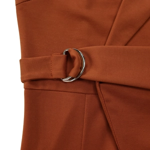 Detail view of caramel brown sleeveless jumpsuit featuring a waist belt with silver D-rings