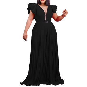 Detail of black pleated jumpsuit featuring a deep V-neckline and tiered ruffle sleeves