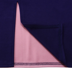 Detailed close-up of double-needle stitching on purple fabric with pink inner lining