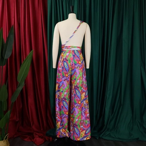 Detailed view of colorful paisley print chiffon fabric on wide-leg jumpsuit