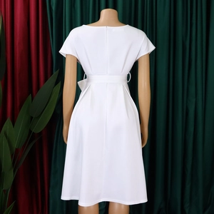 Rear view of elegant white short-sleeve midi dress with waist belt and hidden zipper