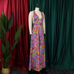 Detailed view of paisley print halter neck jumpsuit with wide-leg design and vibrant colors