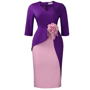 Detail of V-neck dress with 3D floral accent and fine fringe trim on the waistline