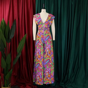 Detailed view of vibrant paisley and floral print on bohemian wide-leg jumpsuit