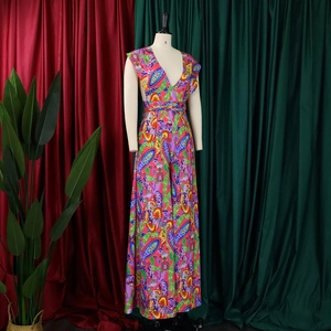 Detailed view of colorful paisley print wide-leg jumpsuit with deep V-neckline