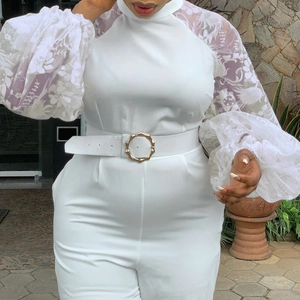 Elegant white slim fit jumpsuit featuring lace puff sleeves and a gold buckle waist belt