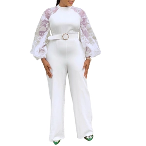 Elegant white wide-leg jumpsuit with lace puff sleeves and a matching round buckle belt
