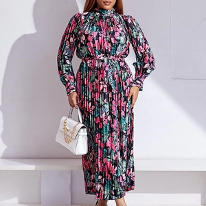 Detail of floral printed pleated maxi dress with high neck and matching waist tie