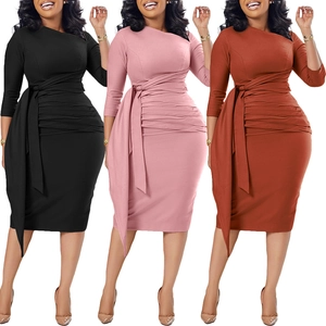 Close-up of pleated waist detail and long ribbons on professional bodycon dresses