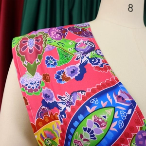 Detail of bohemian floral print fabric and clean stitching on women's halter jumpsuit