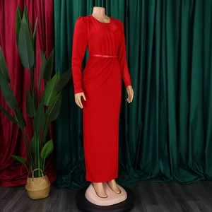 Detail of red long sleeve dress with waist belt and elegant cross pleat bodice design