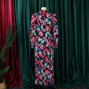 Back view detail of tropical floral maxi dress with pink flowers and green palm leaves