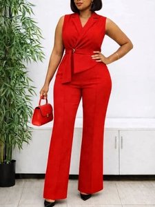Fashionable red sleeveless jumpsuit with notched lapel and waist tie for a stylish look