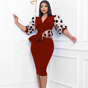 Elegant red peplum dress with V-neckline and polka dot puff sleeves for formal wear