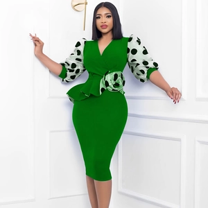 Slim fit emerald green V-neck dress with polka dot puff sleeves and ruffle waist detail
