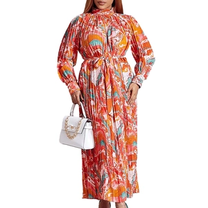 Elegant long sleeve pleated maxi dress with colorful abstract print and waist belt for women