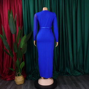 Detail of royal blue bodycon dress featuring sheer mesh sleeves and elastic fabric