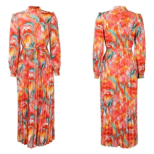 Detail view of colorful abstract print maxi dress with long sleeves and pleated texture