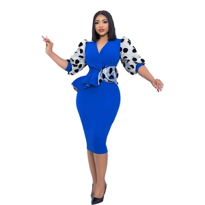 Detail of blue V-neck pencil dress with polka dot puff sleeves and waist flower decoration