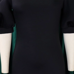 Close-up of black bodycon dress featuring puff sleeves and elegant slim fit tailoring