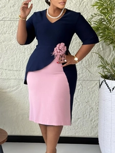Elegant navy and pink contrast midi dress with 3/4 sleeves and a 3D fabric flower detail
