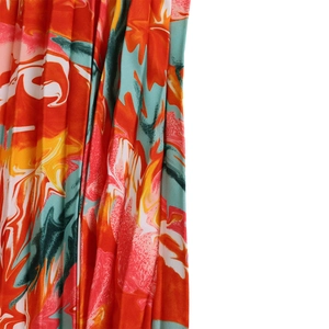 Detail of colorful marble print fabric with pleated texture and fluid art pattern