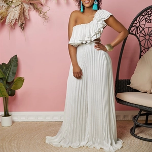 White two-piece set with one-shoulder ruffled top and pleated wide-leg trousers suit